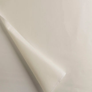 A piece of lining fabric in a waterline style, slightly folded, showing both ivory and white colors. Alendel Drapery Lining