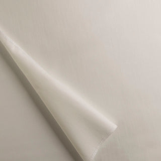 A close-up view of a piece of drapery lining fabric in an ivory color, showing the texture and slight sheen of the material.