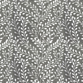 Close-up view of a gray fabric with a white floral pattern.