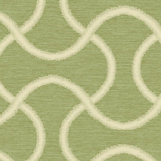 Close-up of a green fabric with a white geometric pattern