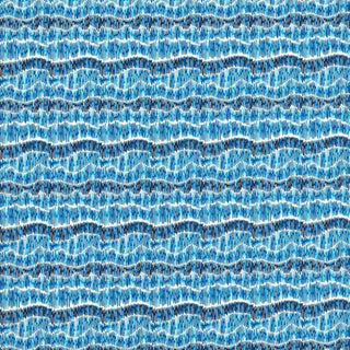 A close-up image of a textile pattern featuring a series of blue wavy lines on a fabric.