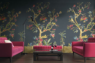 Crown Surface Solution Daisy Bennett Decorative wall with floral tree design and pink sofas in a room.