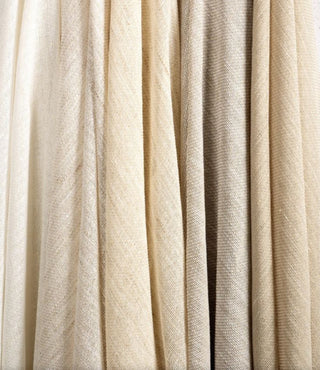 Kravet Aloft drapery collection Close-up of beige fabric with a subtle pattern