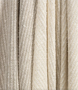 Kravet Aloft drapery collection Close-up of textured beige fabric with a subtle pattern
