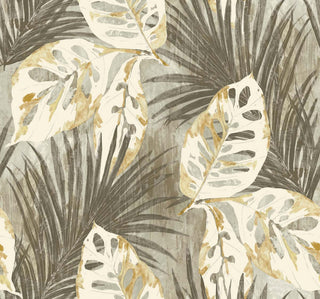 Crown Bali Tropical Karma wallpaper featuring a bold tropical leaf pattern. Large monstera leaves in white and gold overlay grey palm fronds set against a textured light grey background for a vibrant, painterly wall statement.