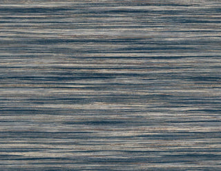 Crown Bali Tropical Gita wallpaper featuring a textured linear design. Horizontal striations in deep navy blue, slate gray, and subtle warm metallic bronze tones blend seamlessly to create a modern, organic grasscloth effect for walls.