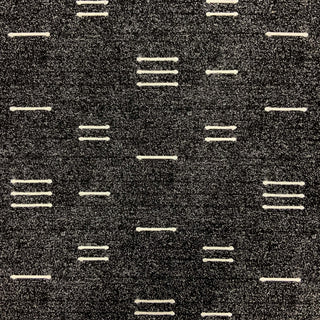 JF Fabrics Marisol fabric collection. A close-up view of a textured speckled black and white colour fabric with organic broken stripe pattern. 