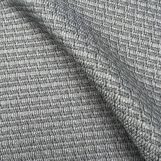 JF Fabrics St. Tropez fabric collection. A close-up view of a textured stone grey fabric with a subtle pattern