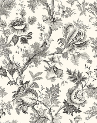 A close-up view of the Cabris wallpaper swatch from the Crown Provence collection. The pattern is a classic French Toile de Jouy, featuring winding botanical branches, large ornate blossoms, detailed leaves, and hanging pomegranates or figs. The entirely monochromatic design is rendered in shades of timeless white and light grey, standing out against a crisp cream background. The backdrop features a subtle linen-textured faux weave, giving this elegant print a warm, high-end fabric-like depth.