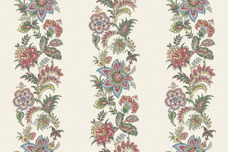 A close-up view of the Callas wallpaper swatch from the Crown Provence collection. The design features rich, vertical trails of intricate botanical florals, vines, and ornate blossoms in red, soft yellow, bluel, and sage green tones. These vibrant, folk-inspired floral stripes repeat gracefully across a light beige background. The backdrop is enhanced with a tactile, linen-look faux weave texture that gives the pattern a warm, high-end fabric appearance, blending rustic charm with elegant detail.