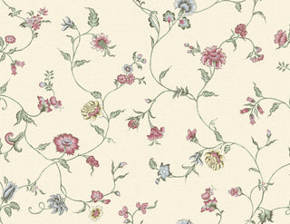 A close-up view of the Cassis wallpaper swatch from the Crown Provence collection. The pattern features a delicate, sprawling floral trail design with winding green stems, slender leaves, and dainty blossoms in soft shades of rose pink, muted yellow, and pale blue. The elegant, whimsical botanical trails gracefully intertwine across a light cream background. A subtle, linen-look faux weave texture runs throughout the backdrop, adding a gentle fabric-like depth to this traditional country-cottage print.