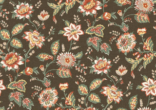 A close-up view of the Castellane wallpaper swatch from the Crown Provence collection. The pattern features a sprawling, traditional floral trail design with detailed botanical blossoms, twisting stems, and leafy sprigs. The flowers and foliage are illustrated in soft shades of yellow, orange, and light green, contrasting beautifully against a rich brown background. A subtle, linen-textured faux weave runs across the surface, giving the elegant, country-cottage print an inviting, fabric-like de