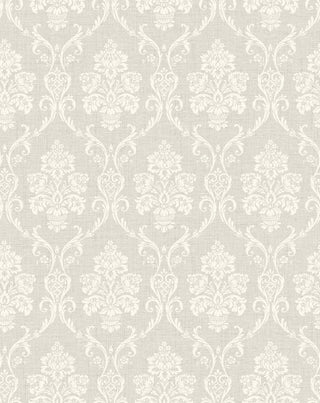 A close-up view of the Istres wallpaper swatch from the Crown Provence collection. The pattern features an ornate, classic damask motif showcasing elegant floral bouquets in stylized urns, enclosed by delicate scrolling acanthus leaves. The intricate design is rendered in a off-white tone that sits subtly against a light grey background. The backdrop is enhanced with a fine, linen-textured faux weave, giving the traditional pattern a tactile, fabric-like depth and a serene, sophisticated feel.