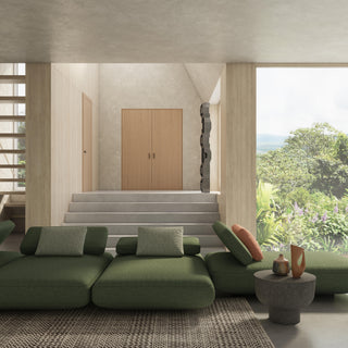 Modern living room with sofa upholstered in JF Fabrics Lennon collection in Emerald green  and wooden doors