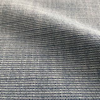 JF Fabrics St. Tropez fabric collection. Close-up of faux linen texture azure blue and white fabric with a subtle pattern