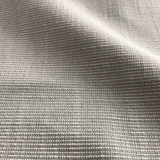 JF Fabrics St. Tropez fabric collection. Close-up of faux linen texture stone grey and cream fabric with a subtle pattern