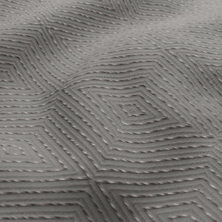 Close-up of textured gray material with geometric pattern