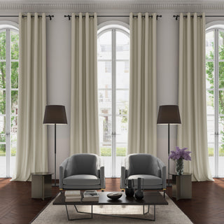 Modern living room with gray armchairs, a coffee table, and large windows with curtains in Porcelain colour by JF Fabric Pixie collection
