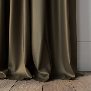 Sage curtain, by JF Fabrics Pixie collection to wooden floor with a white wall in the background