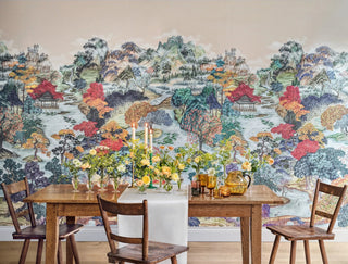 Dining room with a large wall mural of a colorful landscape.