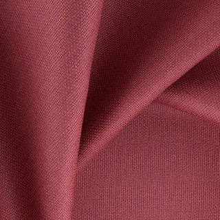 JF Fabrics Splash fabric. Close-up of blue fabric with a textured pattern in magenta