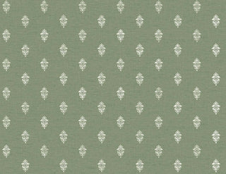 A close-up view of the Sault wallpaper swatch from the Crown Provence collection. The pattern features a small, intricate repeating damask or fleur-de-lis inspired motif in a crisp white color. The motifs are arranged in a neat, staggered half-drop layout across a light green background. The backdrop has a subtle, linen-look texture with fine horizontal faux-weave lines that add depth and a fabric-like quality to the design. The overall aesthetic is classic, tailored, and traditionally elegant.
