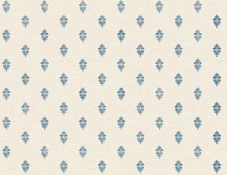 A close-up view of the Sault wallpaper swatch from the Crown Provence collection. The pattern features a small, intricate repeating damask or fleur-de-lis inspired motif in a crisp blue color. The motifs are arranged in a neat, staggered half-drop layout across a beige background. The backdrop has a subtle, linen-look texture with fine horizontal faux-weave lines that add depth and a fabric-like quality to the design. The overall aesthetic is classic, tailored, and traditionally elegant.