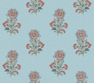 A close-up view of the Sellans wallpaper swatch from the Crown Provence collection. The pattern features an elegant, repeating Indian block-print inspired floral motif arranged in a staggered, half-drop layout. Each delicate botanical sprig showcases a prominent stylized blossom surrounded by smaller buds and detailed foliage in soft shades of French blue, dusty denim, and sage green. The intricate design is set against a clean, light blue background, offering a serene, traditional aesthetic.