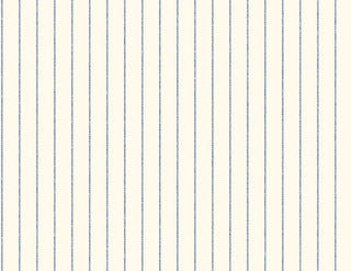 A close-up view of the Tourves wallpaper swatch from the Crown Provence collection. The pattern features thin, delicate vertical ticking stripes in a classic blue color, evenly spaced across the surface. The background is a soft, off-white or light cream linen-textured fabric look, showing a subtle faux-weave that adds depth and warmth to the design. The overall aesthetic is a clean, timeless country cottage style, perfect for creating a bright, elegant, and traditional interior space.