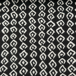 JF Fabrics Marisol collection, close-up view of black fabric with white geometric pattern