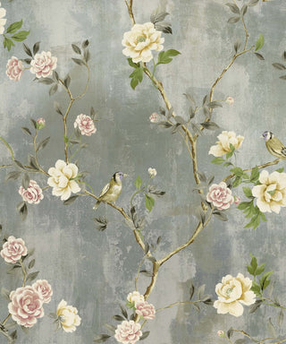 A wallpaper swatch from Crown’s Chinoiserie collection featuring the Jangmi Trail pattern, with slender branches carrying green leaves and soft pink and cream flowers. Two small birds perch among the blooms, adding charm to the design. Set against a light green background, the composition feels delicate, elegant, and nature‑inspired with a refined botanical style